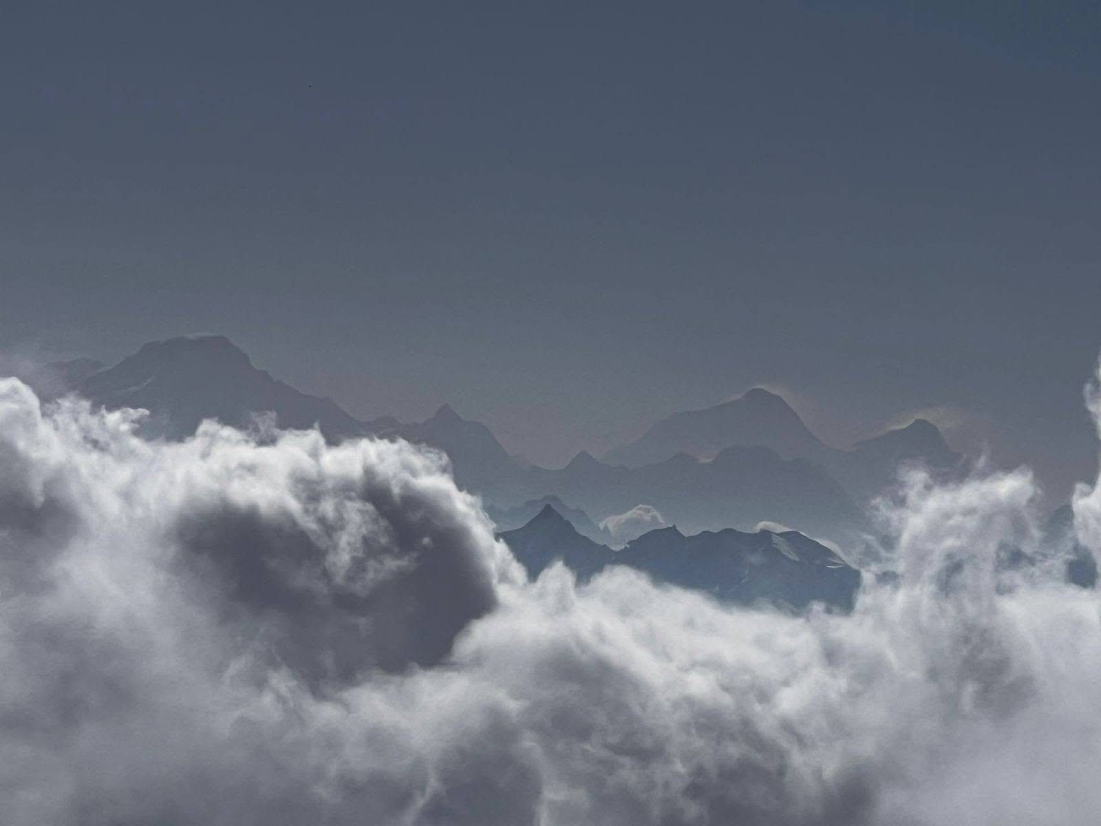 Everest and the high Himalaya rising above the clouds, seen from Jugal Everest View Point